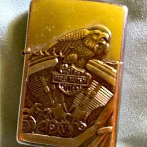 Harley Davidson items. Lighter, women’s watch & bracelet, pocket watch.